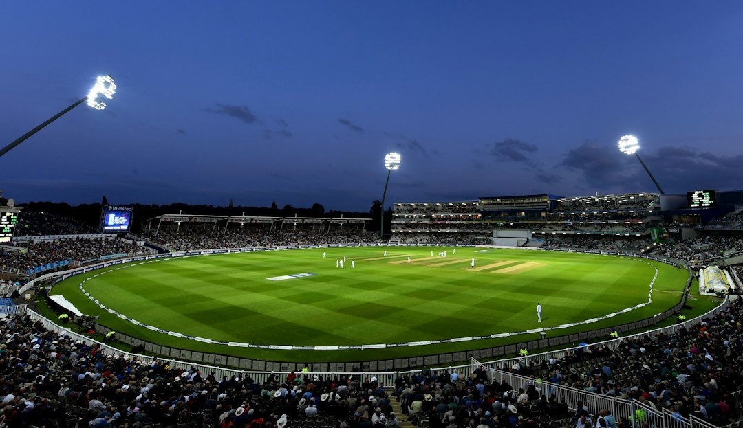 Cricket stadium crowd watching a night match